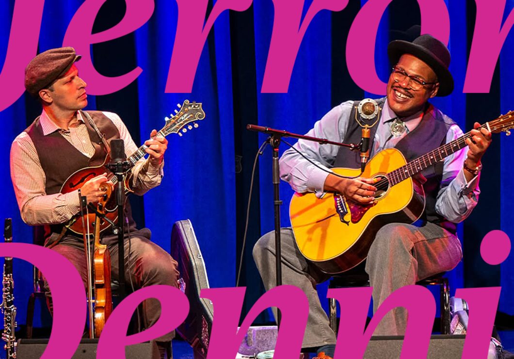 Jerron Paxton and Dennis Lichtman performing on the stage, with text that says, "Jerron Paxton and Dennis Lichtman."