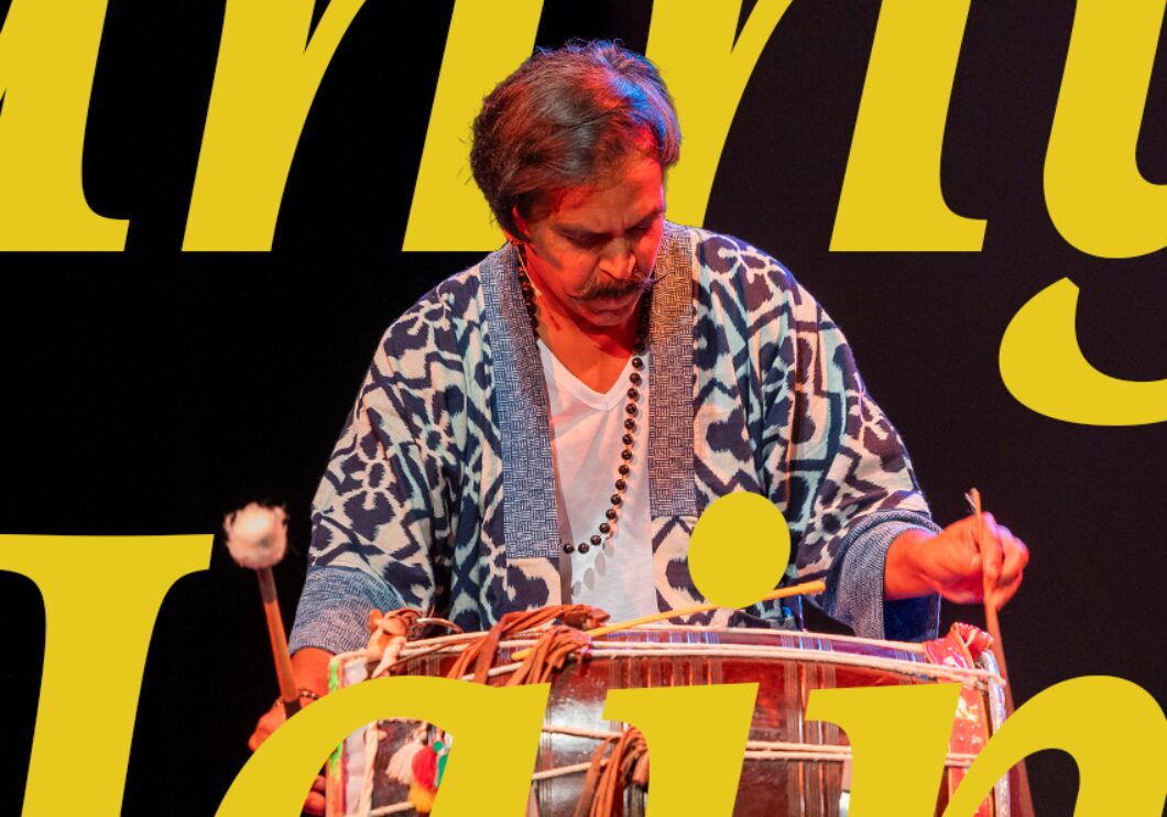 Sunny Jain performing on the stage, with text that says, "Sunny Jain."