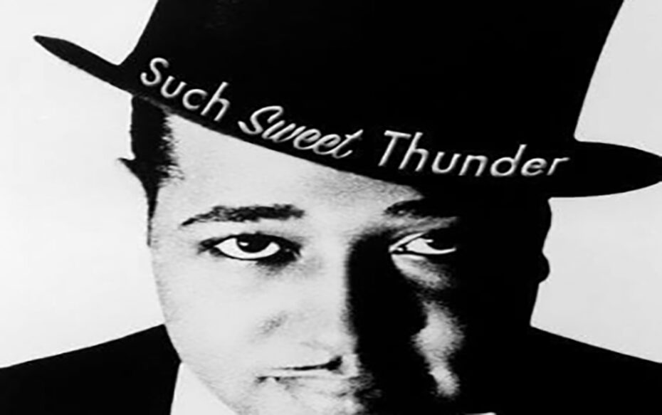 Close up black and white photo of Duke Ellington wearing a top hat. The show title Such Sweet Thunder, appears on the hat brim.