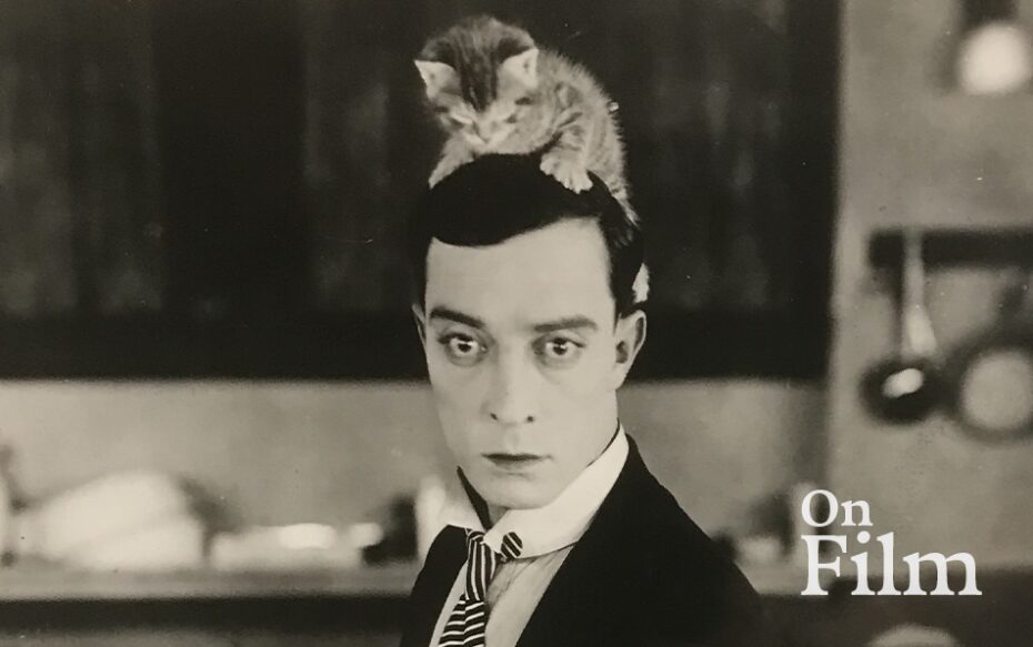 Buster Keaton with a kitten on his head.