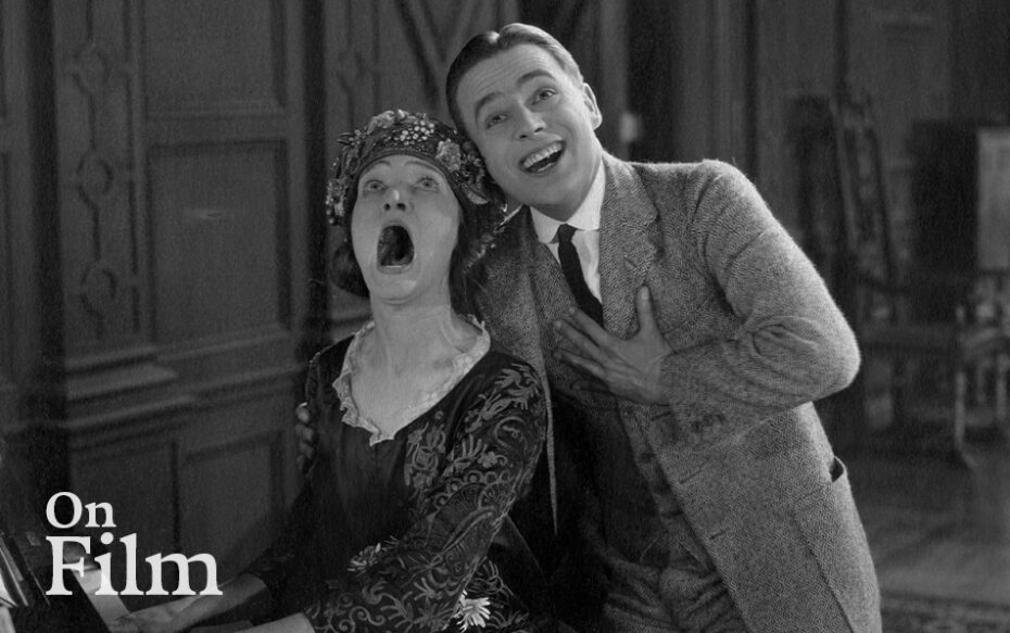 A scene from the film Bell Boy 13 featuring Douglas MacLean and Margaret Loomis.