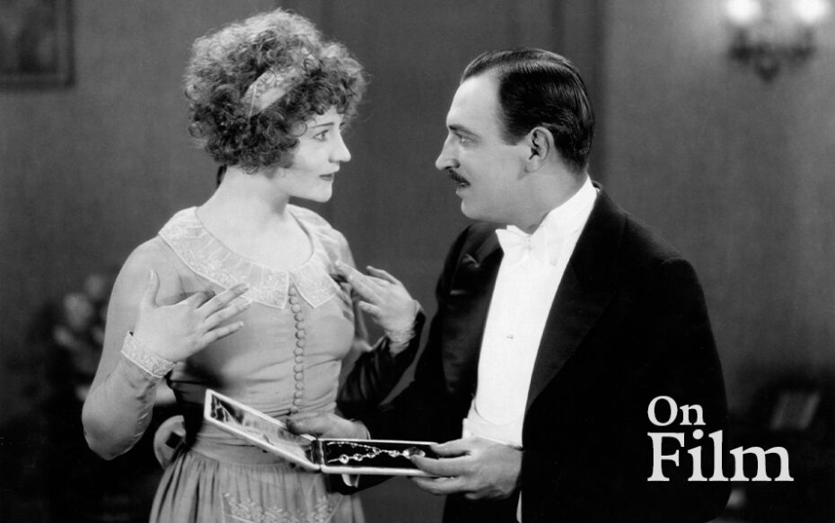 Clara Bow and Ralph Forbes in Paths to Paradise.