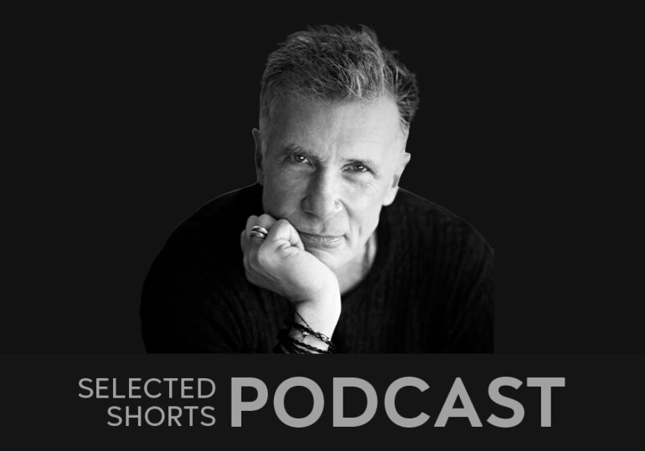 Michael Cunningham, a man with short graying hair looks forward with his chin cradled in his hand.