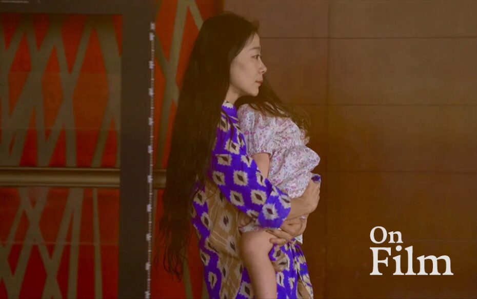 A woman holding a young child.