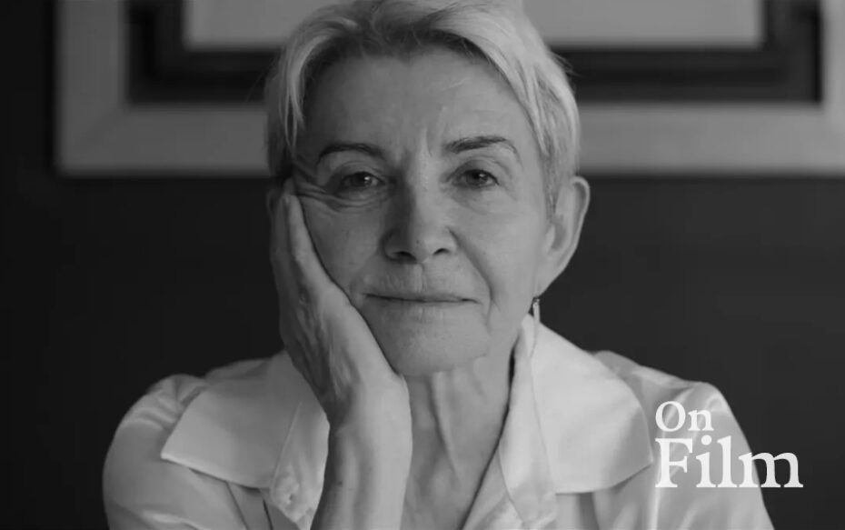 A woman rest her face in her hand.