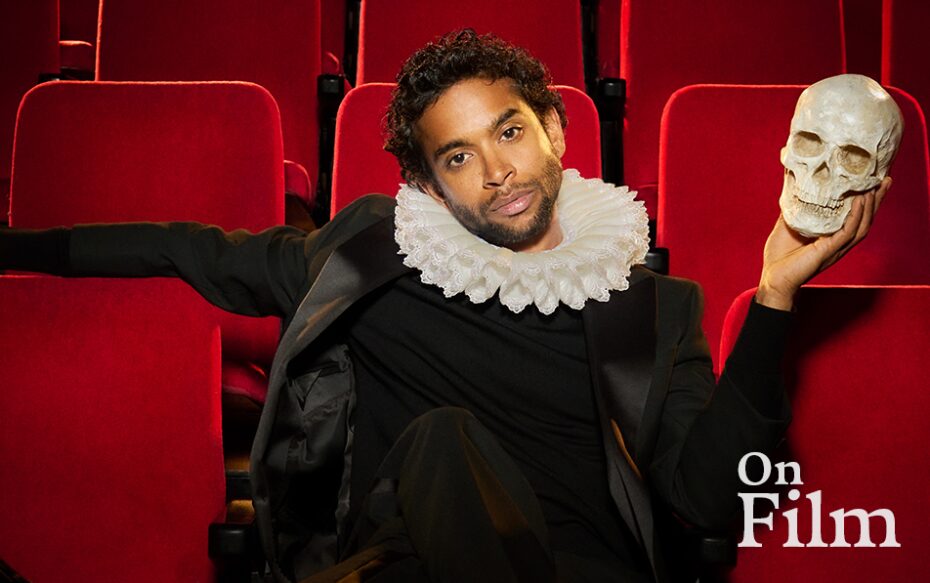 Hiran Abeysekera in costume as Hamlet, holding a skull.