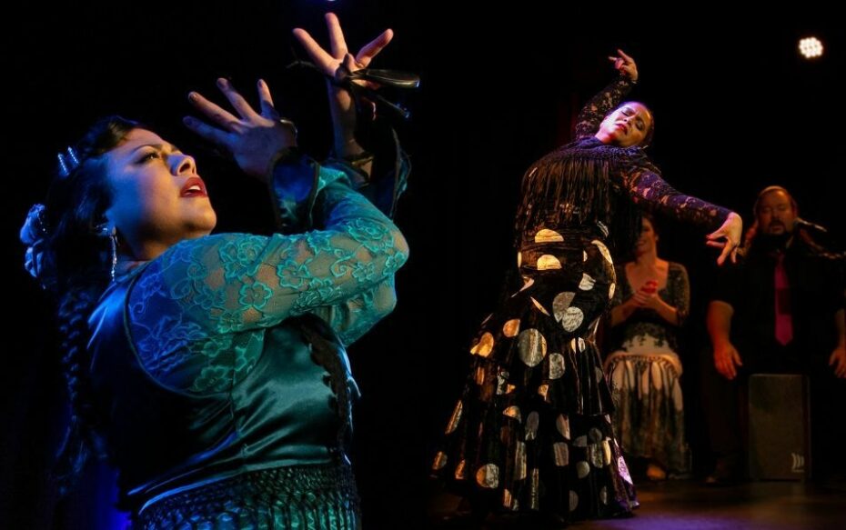 A split frame photo of dancers of Andrea La Flor Gonzalez and Amirza Hernandez, both wearing traditional flamenco dresses and posed with castanets in their hands.