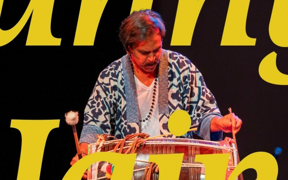 Sunny Jain performing on the stage, with text that says, "Sunny Jain."