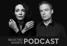 Katrina Lenk, a woman with dark hair, and Justin Kirk, a man with short hair look straight ahead.