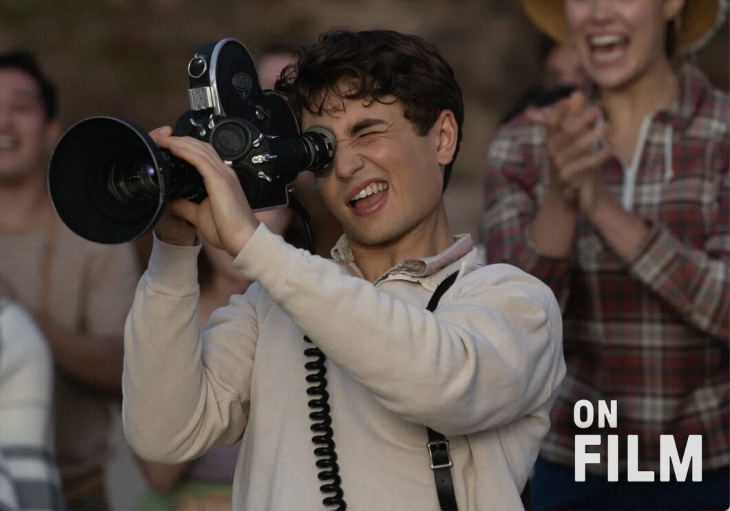 A still from the movie The Fabelmans, featuring a young man looking into a camera.