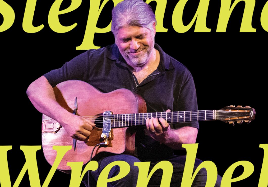 Stéphane Wrembel playing guitar in front of a black background, with text that says, "Stéphane Wrembel."
