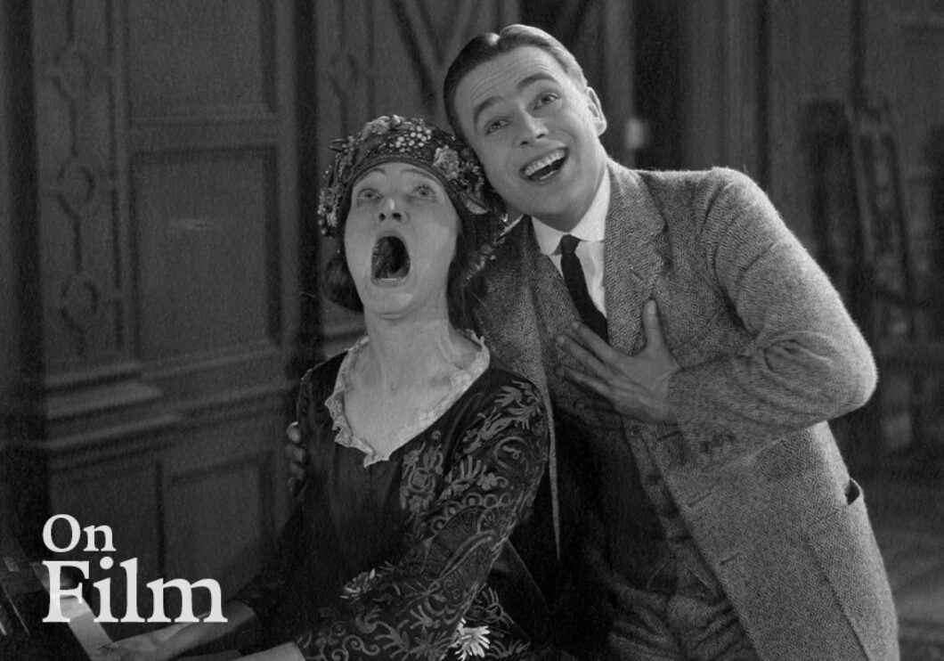 A scene from the film Bell Boy 13 featuring Douglas MacLean and Margaret Loomis.