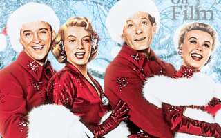 Bing Crosby, Danny Kaye, Rosemary Clooney, and Vera-Ellen wearing red and white outfits in the movie White Christmas.