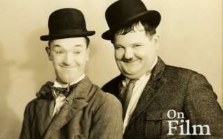 A black and white photo of Laurel and Hardy.