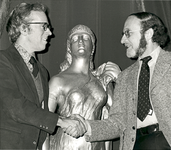 Allan Miller and Isaiah Sheffer shaking hands.