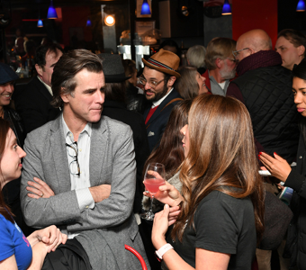The Bar Thalia filled with people gathering together.