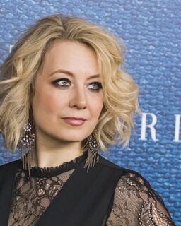 Jennifer Mudge with short hair against a blur background