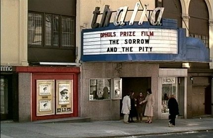 A vintange photograph of the outside of the Thalia move theater.