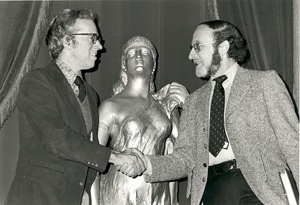 Allan Miller and Isaiah Sheffer shaking hands.