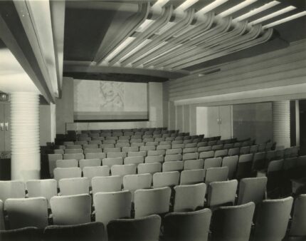 An image of the Thalia Theatre auditorium, featuring many rows of seats.